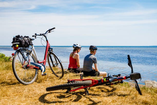 A couple is stay on sea view while electric bike camping