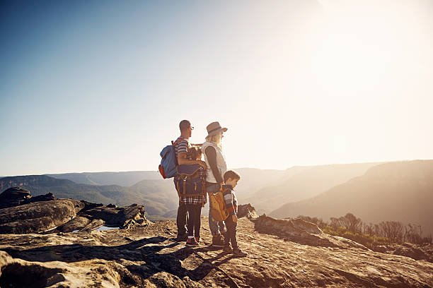 Shot of a young family with backpacking with kids going on a hike in the mountains 